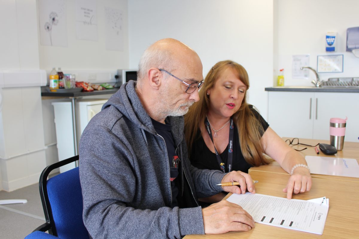 Rebuild mental health course learner and their tutor looking at coursework