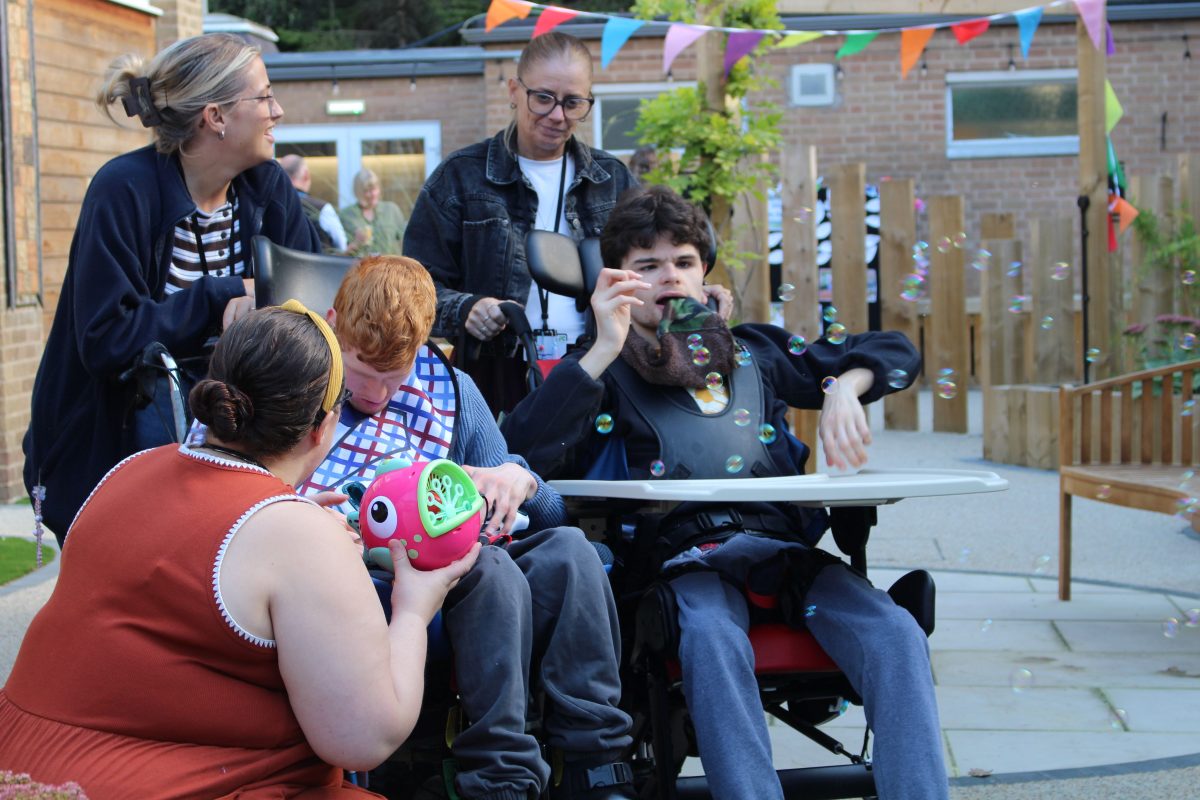 Learners enjoy exploring the new Chestnuts sensory garden during its official opening event.